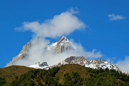 Double Summit of Mount Ushba, One of the Most Notable Peaks of the Greater Caucasus Range, Svaneti region, Georgiaの写真素材