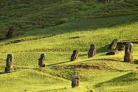 Many of Abandoned Gigantic Moai Statue Ruins on the Slope of Rano Raraku Volcano, Former Moai Quarry on Easter Island of Chileの写真素材
