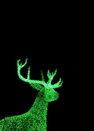 Vivid Green Illuminated Christmas Reindeer Shaped Outdoor Decoration Lights on Dark Backgroundの写真素材