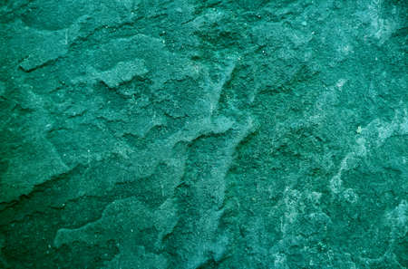 Pop art style viridian green colored rough stone's surface textureの写真素材