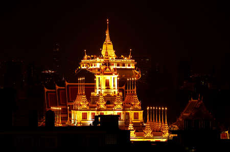 Spectacular Night View of Top of Loha Prasat (Iron Castle) of Wat Ratchanatdaram Temple and Phu Khao Thong (Golden Mount) of Wat Saket Temple in Bangkok, Thailandのeditorial素材