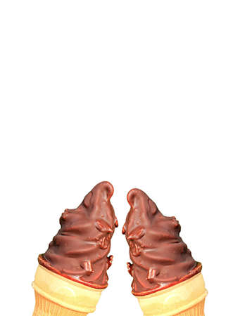 Vertical Image of Two Chocolate Coating Soft Serve Ice Cream Cones Clinking on White Backgroundの写真素材