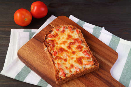 Fresh baked delectable homemade pizza toast on kitchen's table