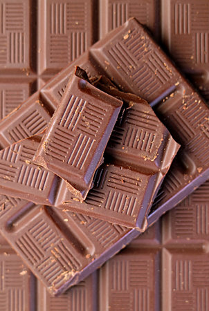 Closeup of chocolate bars and chunks for backdrop or wallpaperの写真素材