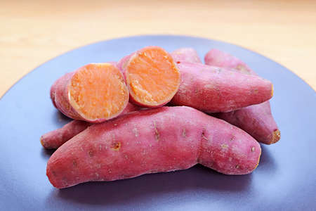 Plate of Tasty Boiled Sweet Potatoes for a Concept of Whole Foods Plant-based Dietの写真素材