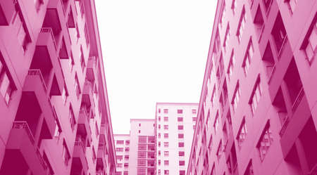Surreal Pop Art Style Low Angle View of Modern High Buildings in French Rose Pink Colorの写真素材