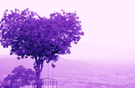 Pop Art Surreal Style Heart Shaped Tree on Cloudy Sky in Purple Color Toneの写真素材