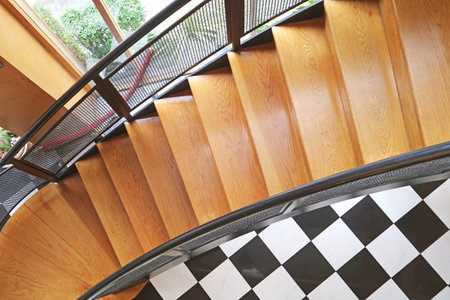 Curved Wooden Staircase in a Modern Houseの写真素材
