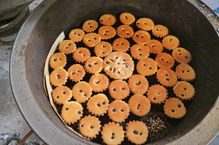 Delectable Freshly Baked Khanom Farang Kudeejeen in a Brazier, a Famous Portuguese Influenced...