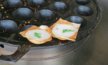 Kanom Krok with Spring Onion Topping, Thai coconut milk pancake which one of the popular street food in Thailandの写真素材