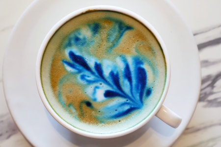 Mouthwatering cappuccino coffee with blue butterfly pea latte artの写真素材