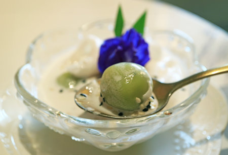 Closeup of Khanom Kho Kati, Delicious Thai Southern Coconut Dumplings in Sweetened Coconut Milkの写真素材