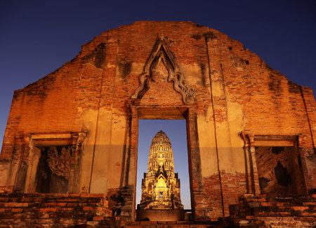 Striking View of Wat Racha Burana Buddhist Temple's Vihara and Central Prang at Night, Ayutthaya Historical Park, Thailandの写真素材