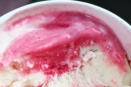Closeup of a cup of mouthwatering strawberry yogurt ice creamの写真素材