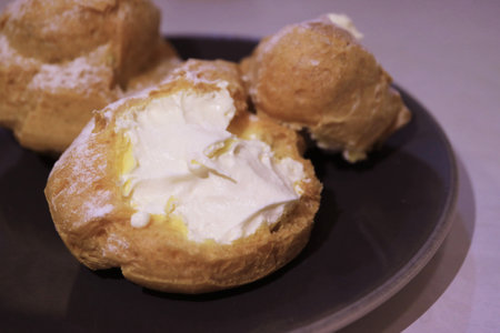 Closeup of Mouthwatering French Cream Puffs or Choux a la Cremeの写真素材