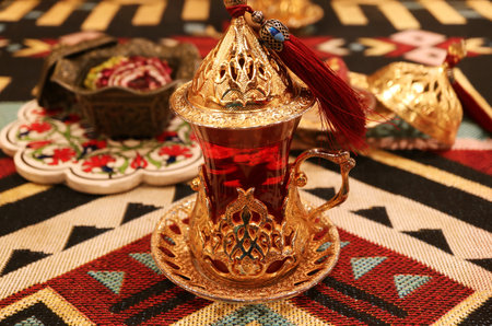 Closeup of Hot Turkish Pomegranate Tea in an Elaborated Tulip-shaped Glassの写真素材