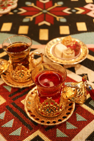Cups of Hot Turkish Pomegranate and Apple Tea with a Plate of Assorted Turkish Delightsの写真素材