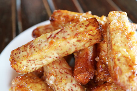 Pile of Mouthwatering Deep Fried Sugar Coated Taro Sticksの写真素材