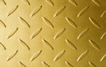 Artistic surface texture of gold color metal flooring backgroundの写真素材
