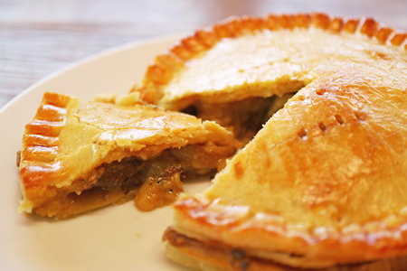 Closeup of freshly baked mouthwatering golden brown beef pieの写真素材