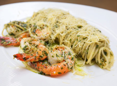 Closeup of Mouthwatering Spaghetti with Shrimp and Pestoの写真素材