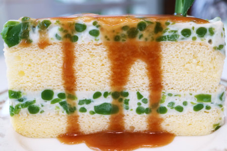 Mouthwatering Lod Chong Chiffon Cake, a Thai Style Pandan Flavored Rice Flour in Sweetened Coconut Cream Topped with Palm Sugar Syrupの写真素材