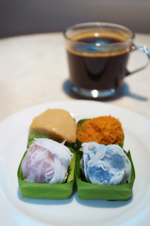 Tasty Khanom Tom and Sticky Rice with Sweet Toppings, Popular Thai Traditional Dessertの写真素材