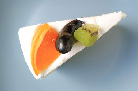 Top View of a Slice of Chiffon Cake Topped with Assorted Fresh Fruitsの写真素材