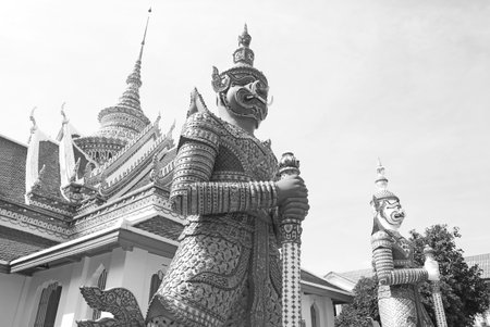 Monochrome Image of Giant Tossakan and Giant Sahatsadecha Sculptures Guarding at the Eastern Gate of Wat Arun or The Temple of Dawn, Bangkok, Thailandの写真素材