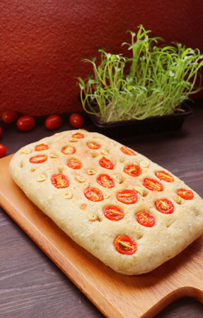 Delectable Freshly Baked Italian Tomato and Garlic Focaccia Breadの写真素材