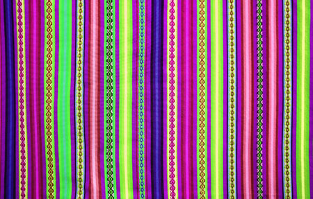 Eye-catching vibrant multi-color toned stripes of Peruvian textileの写真素材