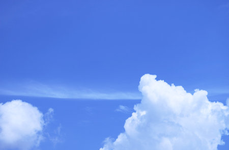 Pure White Fluffy Clouds Floating on Vibrant Blue Sky
