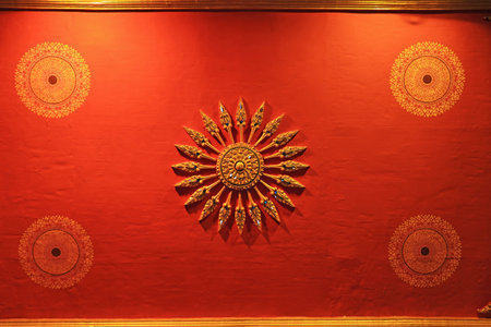 Ornate Ceiling of the Ordination Hall of Buddhist Temple in Thailandの写真素材