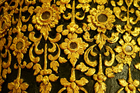 Gorgeous Gold and Black Thai Vintage Pattern on the Teak Lacquered Pillar in Wat Phumin Temple, Nan...