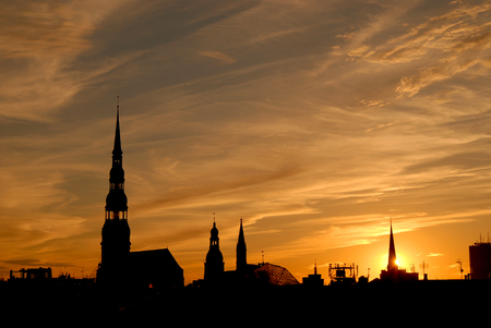 City silhouettes - Picturesque sunset over old Riga city, Latviaの写真素材