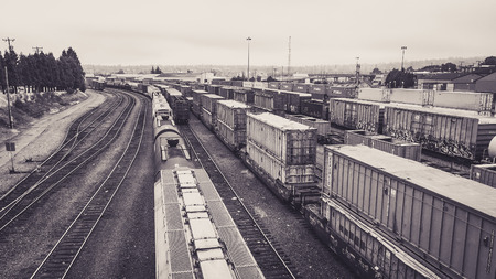 Seattle, Washington, USA - July 27, 2015: trains carry containers and oil tanks stop and wait to unload at Balmer Yard, Seattle, Washington, USA.のeditorial素材