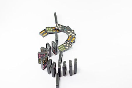 dollar dominoes concept isolated on blue backgroundの写真素材