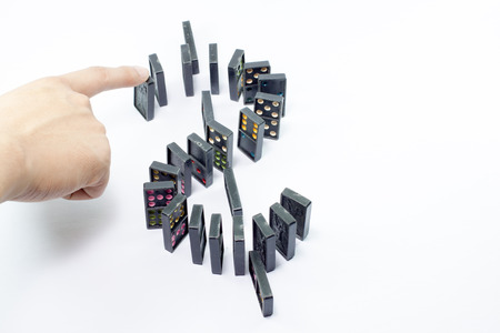 Concept for solution to a problem by stopping the domino effectの写真素材