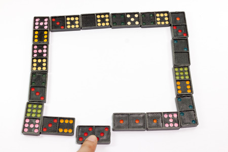Domino effect. The Falling Domino Prinsiple. The Domino principle. The game of dominoes.の写真素材
