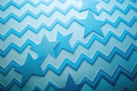 Blue paper background with stars.の素材
