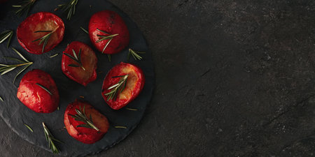 Oven-Roasted Tomatoes with Rosemary on Dark Plate, Gourmet Vegetable Dishの素材