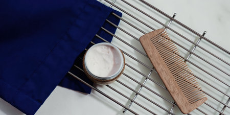 Bamboo Comb and Soap on Drying Rack with Blue Towelの素材