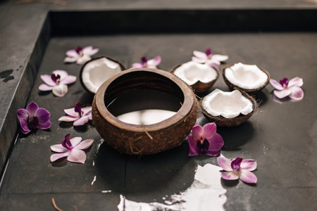Coconut Bowl with Flowers on a Dark Surfaceの素材