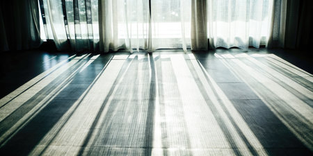 Blurred background of a room with white curtains and blinds.の素材