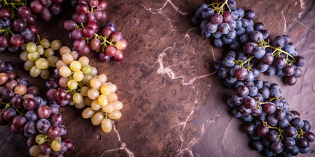 Bunch of grapes on a marble background, top view, copy spaceの素材