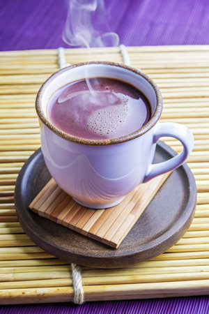Cup of hot tea on a bamboo mat. Selective focus.の素材