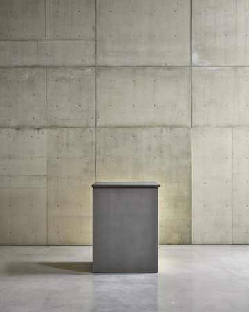 Mockup of a grey metal box on a concrete wall backgroundの素材