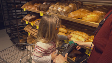 Family makes purchases in the supermarketの写真素材