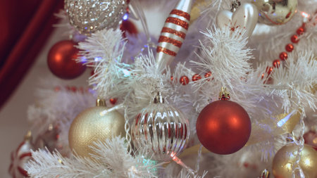 Process of decorating the Christmas tree with beautiful toysの写真素材