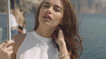 Young sexy woman on the yacht at sunny summer dayの写真素材